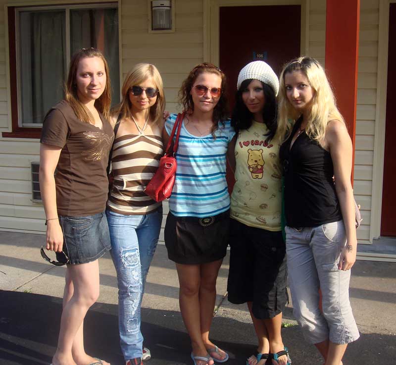 Russina group in front of a motel